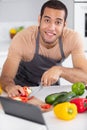 view young attractive man cooking in kitchen Royalty Free Stock Photo