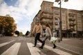 view on young couple in love cross the road and look at each other Royalty Free Stock Photo