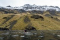 Young lady swimming in outdoor hot water pool during autumn on Iceland