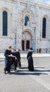 View of Young priests near of Jeronimos or Hieronymites Monastery. Lisbon, Portugal Royalty Free Stock Photo