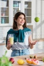 view of young woman in kitchen