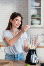 view of young woman in kitchen Royalty Free Stock Photo