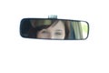 View of a young woman through the rear-view mirror Royalty Free Stock Photo