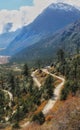 View of zig zag road passing through the valley ,forest and mountains Royalty Free Stock Photo