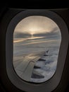 An airplane wing viewed from a passenger window Royalty Free Stock Photo