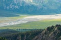 Viewed from the Sheep Creek Trail, the Slims Rover flows toward Lake Kluane in Yukon, Canada