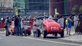 Viewers look at vintage cars participating in a motor rally Gorkyclassic around Moscow with interest, stylized