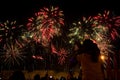 Viewers watch beautiful fireworks in the sky