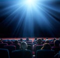 Viewers watch shining light in the cinema Royalty Free Stock Photo