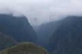 Viewing the clouds descending on the Andes mountains, Vilcambamba mountain range, from Machu Picchu Royalty Free Stock Photo