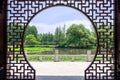 Viewing the Lotus Pond from the Chinese style Full Moon Gate