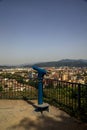 Viewpoint with a coin operated eyeglass on a balcony in a park on a sunny day