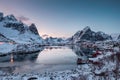 Viewpoint of fishing village with harbor in snow valley and ice