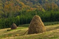 Viewpoint on a landscape of mount Bobija, hills, haystacks, meadows and colorful trees Royalty Free Stock Photo