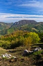 Viewpoint on a landscape of mount Bobija, hills, haystacks, meadows and colorful trees Royalty Free Stock Photo