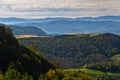 Viewpoint on a landscape of mount Bobija, hills, meadows and colorful forests Royalty Free Stock Photo