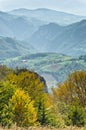 Viewpoint on a landscape of mount Bobija, peaks, hills, meadows and colorfull forests Royalty Free Stock Photo