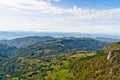 Viewpoint on a landscape of mount Bobija, peaks, hills, meadows and green forests Royalty Free Stock Photo