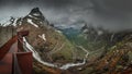 Viewpoint platform of mountain road Trollstigen winding through landscape with waterfall and valley of Trollveggen in Norway Royalty Free Stock Photo