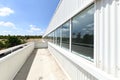 Viewpoint terrace of an industrial warehouse with a large window along