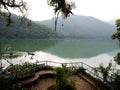 Viewpoint and wooden canoe boat of nepali floating in Phewa Tal or Fewa lake wait service Nepalese people and foreign travelers Royalty Free Stock Photo