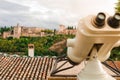 Views of the alhambra from a viewpoint. Binoculars to see up close. Travel and tourism concept in Spain