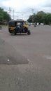 Views of black auto rickshaw with passengers