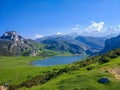 Views of Ercina Lake in Covadonga, Asturias, Spain, from the lookout. Green grassland with mountains at the background Royalty Free Stock Photo