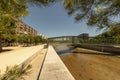 Views of a green painted steel footbridge over the manzanares