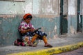 Views of an indigenous woman sewing in Panama City