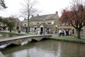 Views of local shops and the River Windrush at Bourton on the Water in Gloucestershire, UK