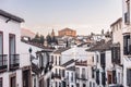 Views of the medieval village of Ronda with white Andalusian houses and the gothic style church of Santuario de Maria