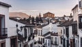 Views of the medieval village of Ronda with white Andalusian houses and the gothic style church of Santuario de Maria