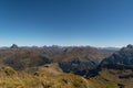 Views of the peaks and mountains of the Pyrenees from the summit of Aspe overlooking the Midi d`Ossau peak