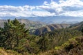 Views of Picos de Europa mountains from Fitu viewpoint Mirador del Fitu. Several lines of hills, colorful ranges. Forest with