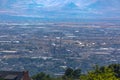 Hazy city views toward power plant and mountains