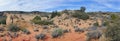 Views of sandstone and lava rock mountains and desert plants around the Red Cliffs National Conservation Area on the Yellow Knolls Royalty Free Stock Photo