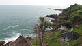 views of the sea with natural stones and green leaves and waves on the Menganti beach Royalty Free Stock Photo