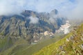 Views on a snowy Chaukhi mountain pass on a hiking trail from Abudelauri lakes to Juta in Caucasus mountains, Georgia