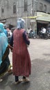 Views of two female walking with each other in the street