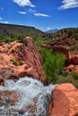 Views of Waterfalls at Gunlock State Park Reservoir Falls, In Gunlock, Utah by St George. Spring run off over desert erosion sands Royalty Free Stock Photo