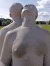 Vigeland park, Oslo, Norway, a couple standing back to back.