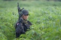 Female Thai soldier surveying during field training