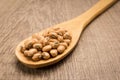 Cowpea legume. Spoon and grains over wooden table.