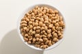 Cowpea legume. Top view of grains in a bowl. White background.