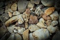 Vignette photo of multi colored river rocks. Royalty Free Stock Photo