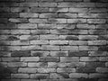 Vignetting Weathered texture of stained old black and white brick wall background, grungy rusty blocks of stone work Royalty Free Stock Photo