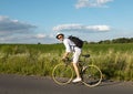 Vigorous Young Male Cyclist in Straw Hat