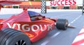 Vigour and success - pictured as word Vigour and a f1 car, to symbolize that Vigour can help achieving success and prosperity in