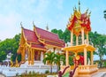 The viharn hall and Ho Rakang bell tower of Wat Sangkharam Temple, Lamphun, Thailand Royalty Free Stock Photo